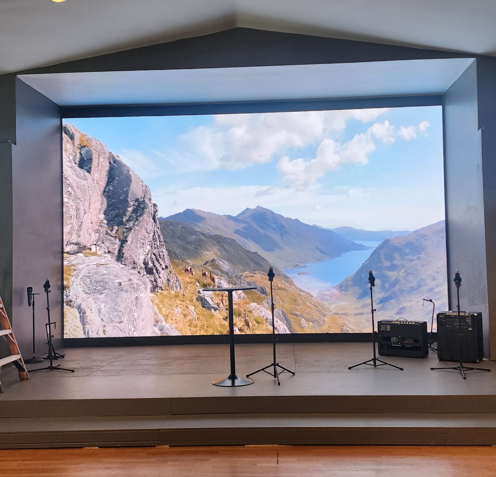 Church stage with LED video wall and DMX spot lights installed by JRO Solutions.